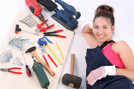 simsearch:400-03947919,k - woman carpenter with work tools on wooden plank Stock Photo - Budget Royalty-Free & Subscription, Code: 400-04040963