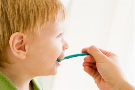 Mother feeding son food Stock Photo - Budget Royalty-Free & Subscription, Code: 400-04041710