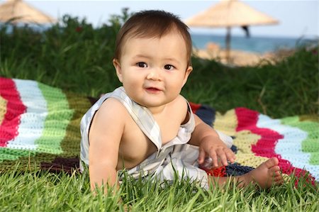 simsearch:400-04594888,k - beautiful baby boy playing on the grass Stock Photo - Budget Royalty-Free & Subscription, Code: 400-04042174