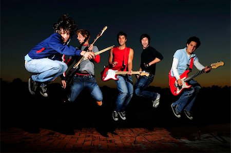 simsearch:400-04026083,k - Portrait of young trendy teenager group jumping with musical instruments Stock Photo - Budget Royalty-Free & Subscription, Code: 400-04042276