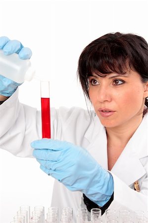 simsearch:400-04881572,k - A scientist adds liquid from a dropper bottle into a test tube Stock Photo - Budget Royalty-Free & Subscription, Code: 400-04043545