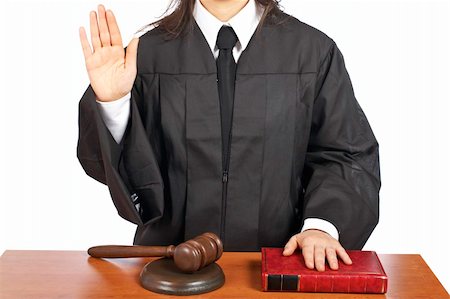 simsearch:700-00028739,k - A female judge taking oath in a courtroom, isolated on white background. Shallow depth of field Stock Photo - Budget Royalty-Free & Subscription, Code: 400-04055487