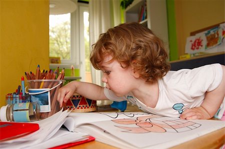 A little artist at work. Drawing in album. Stock Photo - Budget Royalty-Free & Subscription, Code: 400-04057911