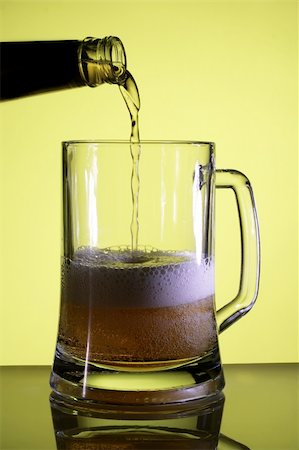 simsearch:400-04083275,k - Beer in a glass. Yellow light backgrounds. Stock Photo - Budget Royalty-Free & Subscription, Code: 400-04059039