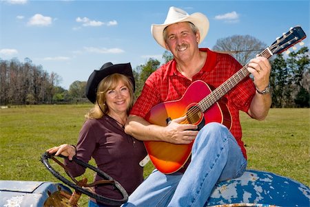 Beautiful mature couple in cowboy hats on the farm. Stock Photo - Budget Royalty-Free & Subscription, Code: 400-04059146