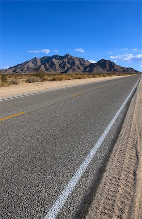 simsearch:400-05112302,k - Old asphalt road in the California with blue sky Stock Photo - Budget Royalty-Free & Subscription, Code: 400-04051380