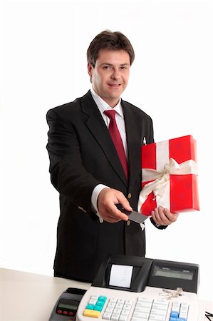 simsearch:400-05708287,k - A man pays for a present with card at the checkout. Stock Photo - Budget Royalty-Free & Subscription, Code: 400-04052159
