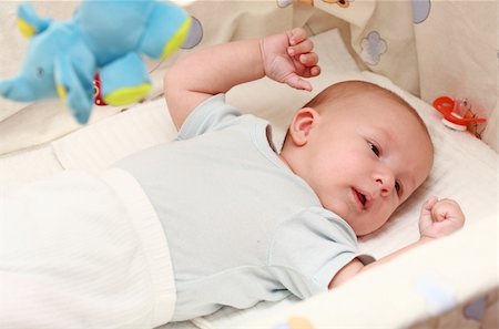 Sweet newborn lying in the cradle Stock Photo - Budget Royalty-Free & Subscription, Code: 400-04052774