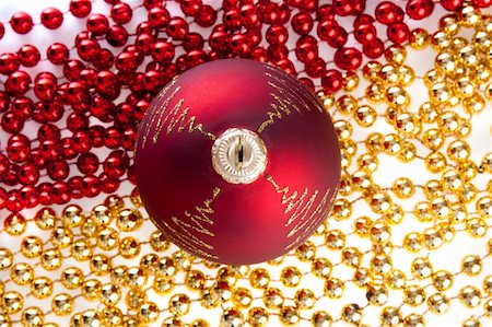 simsearch:400-04499144,k - Red Christmas ball on red and yellow beads, shot from top Stock Photo - Budget Royalty-Free & Subscription, Code: 400-04053198