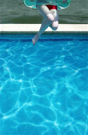 simsearch:400-05381058,k - Young woman jumps into a swimming pool on a hot summer day - perfect for generic holiday and travel usage such as spring break Stock Photo - Budget Royalty-Free & Subscription, Code: 400-04064281