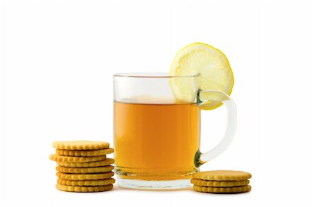 simsearch:400-04273561,k - A cup of hot tea with a slice of lemon and crackers over white background Stock Photo - Budget Royalty-Free & Subscription, Code: 400-04064821