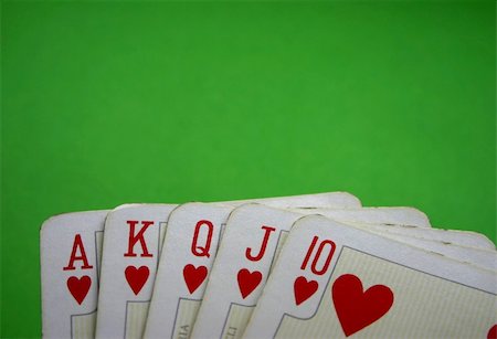 queen of hearts playing card - close-up of Royal Flush against green background Stock Photo - Budget Royalty-Free & Subscription, Code: 400-04065078