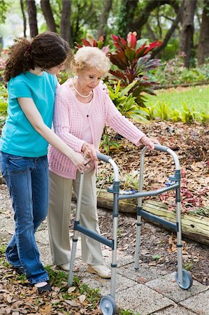 Teen girl helping her grandmother cope with a walker. Stock Photo - Budget Royalty-Free & Subscription, Code: 400-04061250