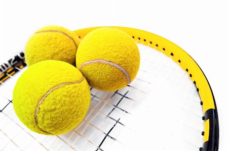 simsearch:400-04833689,k - Close-up on three tennis balls standing on racquet Stock Photo - Budget Royalty-Free & Subscription, Code: 400-04063864