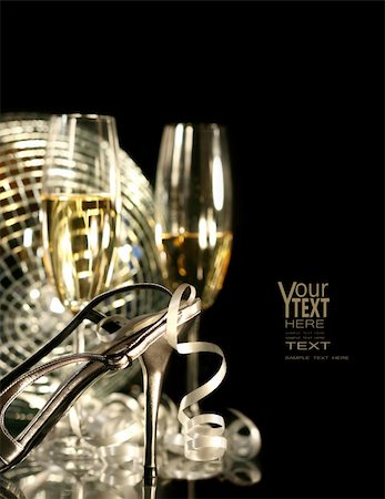 simsearch:400-05117424,k - Silver party shoe with glasses of champagne on black Stock Photo - Budget Royalty-Free & Subscription, Code: 400-04077501