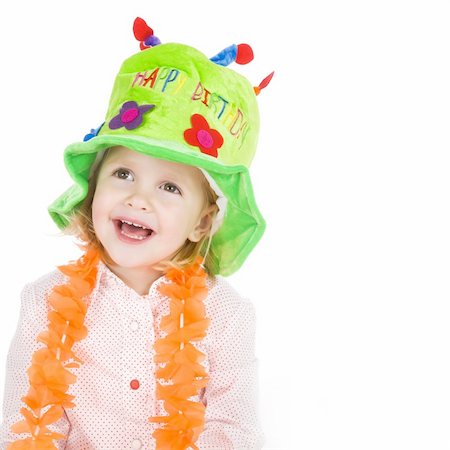 cute little girl with green hat celebrating her birthday Stock Photo - Budget Royalty-Free & Subscription, Code: 400-04079419