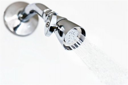 Reflective shower head on white with water stream Stock Photo - Budget Royalty-Free & Subscription, Code: 400-04071089