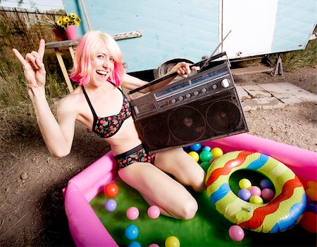 simsearch:400-04831298,k - Woman with a boom box in an inflatable play pool Stock Photo - Budget Royalty-Free & Subscription, Code: 400-04071221