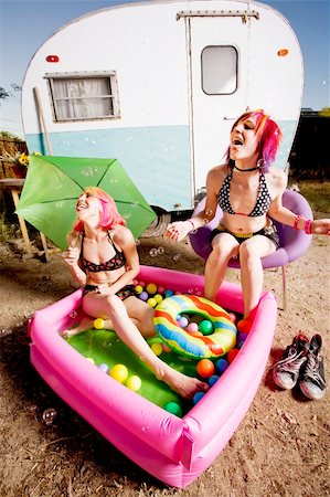 simsearch:400-04831298,k - Woman with in an inflatable play pool playing with bubbles Stock Photo - Budget Royalty-Free & Subscription, Code: 400-04071222