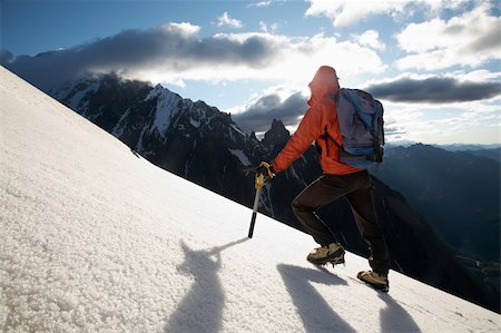 simsearch:400-05118687,k - Lone male mountain climber climbing a snowy ridge; Mont Blanc, Europe. Stock Photo - Budget Royalty-Free & Subscription, Code: 400-04071551