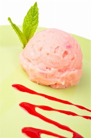 Delicious raspberries ice cream with syrup in green plate. Shallow depth of field Stock Photo - Budget Royalty-Free & Subscription, Code: 400-04073142