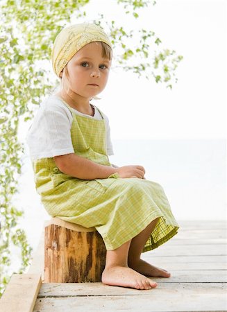 dreaming about eating - little girl sitting at beam Stock Photo - Budget Royalty-Free & Subscription, Code: 400-04088125