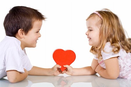 simsearch:400-05368603,k - Two happy kids with valentines heart or birthday gift - isolated Stock Photo - Budget Royalty-Free & Subscription, Code: 400-04082827