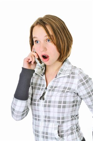 simsearch:400-05012508,k - Teenage girl talking on a cell phone acting surprised isolated on white background Foto de stock - Super Valor sin royalties y Suscripción, Código: 400-04083816