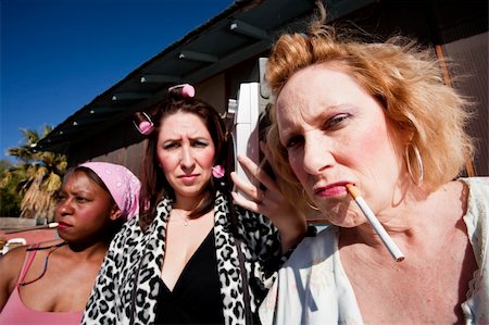 simsearch:400-04099373,k - Portrait of three trashy women outdoors Stock Photo - Budget Royalty-Free & Subscription, Code: 400-04099373