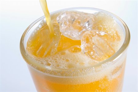 Pouring Orangeade Into A Glass Of Ice Stock Photo - Budget Royalty-Free & Subscription, Code: 400-04105946