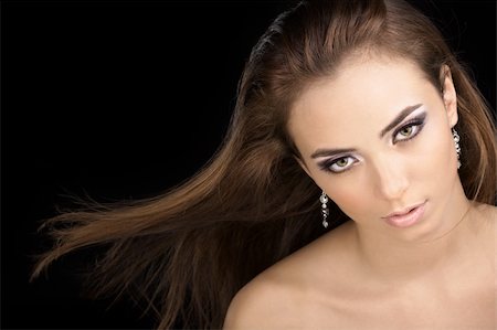 simsearch:400-04626380,k - The beautiful woman with a flying hair on a black background Foto de stock - Super Valor sin royalties y Suscripción, Código: 400-04107683