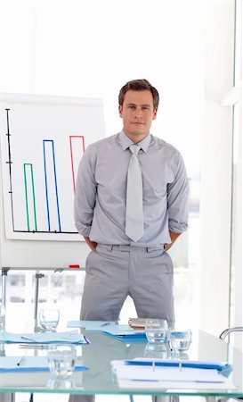 simsearch:400-05710386,k - Man standing before his team at a presentation Stock Photo - Budget Royalty-Free & Subscription, Code: 400-04109282