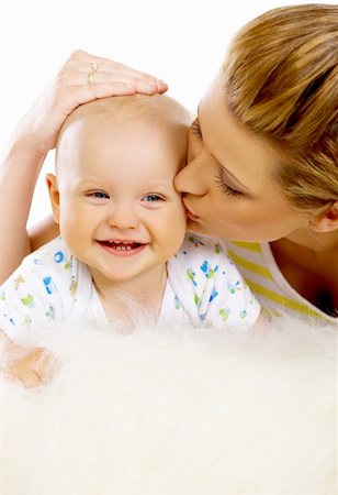 simsearch:400-04397639,k - Young attractive mother kissing cute little baby Photographie de stock - Aubaine LD & Abonnement, Code: 400-04109854