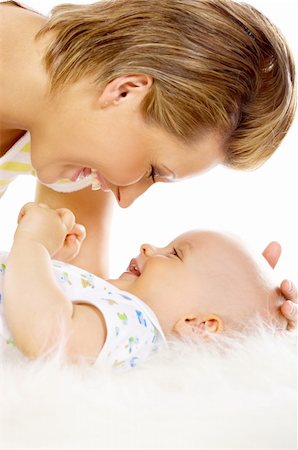 simsearch:400-04397639,k - Young attractive mother kissing cute little baby Photographie de stock - Aubaine LD & Abonnement, Code: 400-04109850