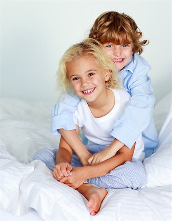 Children waking up together in bed Stock Photo - Budget Royalty-Free & Subscription, Code: 400-04116418