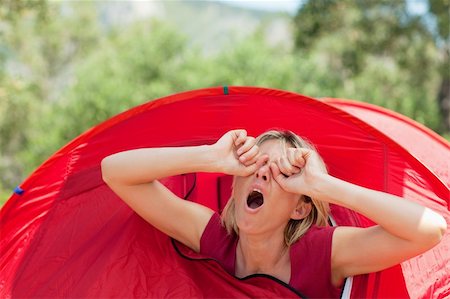 blonde woman in tent waking up and scratching eyes. Stock Photo - Budget Royalty-Free & Subscription, Code: 400-04116801