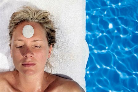 simsearch:400-05318677,k - Woman at a spa with white stone on her forehead Stock Photo - Budget Royalty-Free & Subscription, Code: 400-04117976
