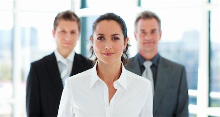 Beautiful young businesswoman in front of her team Stock Photo - Budget Royalty-Free & Subscription, Code: 400-04118168