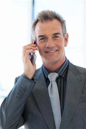 phone one person adult smile elderly - Mature businessman talking on phone in office Stock Photo - Budget Royalty-Free & Subscription, Code: 400-04118220