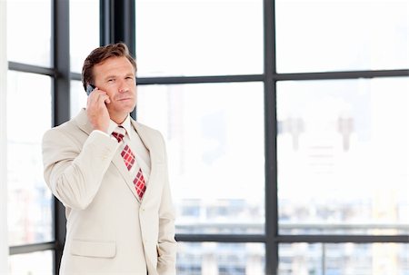 simsearch:400-05145011,k - Mature businessman talking on phone with copy-space Stock Photo - Budget Royalty-Free & Subscription, Code: 400-04118250