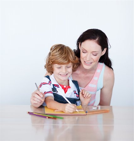simsearch:400-05749563,k - Mother and son writing together at home Stock Photo - Budget Royalty-Free & Subscription, Code: 400-04118433