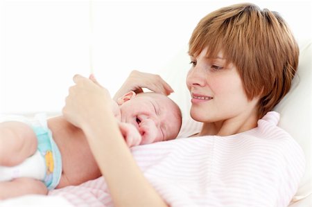 Mother attending to her newborn baby in hospital Stock Photo - Budget Royalty-Free & Subscription, Code: 400-04118442