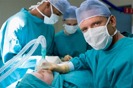 Three Surgeons Operating On A Patient Stock Photo - Budget Royalty-Free & Subscription, Code: 400-04119004