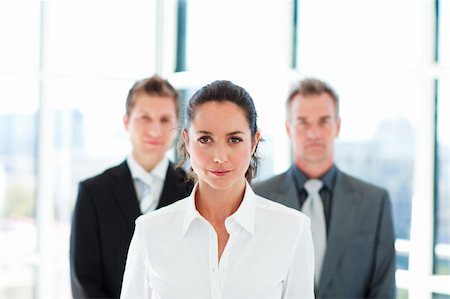 Young brunette businesswoman leading her team Stock Photo - Budget Royalty-Free & Subscription, Code: 400-04119260