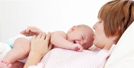 Happy mother kissing her newborn baby in hospital Stock Photo - Budget Royalty-Free & Subscription, Code: 400-04119424