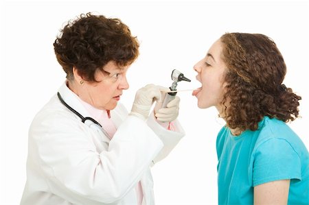 Teen girl being examined by a female doctor.  Isolated on white. Photographie de stock - Aubaine LD & Abonnement, Code: 400-04119577