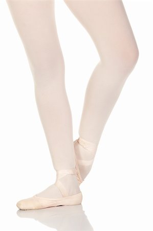 simsearch:400-04119672,k - Young caucasian ballerina girl on white background and reflective white floor showing various ballet steps and positions. Not Isolated Stock Photo - Budget Royalty-Free & Subscription, Code: 400-04119674