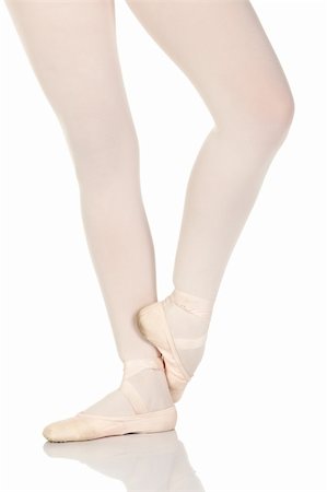 simsearch:400-04119672,k - Young caucasian ballerina girl on white background and reflective white floor showing various ballet steps and positions. Not Isolated Stock Photo - Budget Royalty-Free & Subscription, Code: 400-04119673