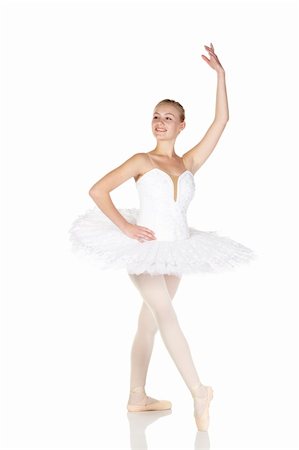 simsearch:400-04119672,k - Young caucasian ballerina girl wearing a tutu on white background and reflective white floor showing various ballet steps and positions. Not Isolated Stock Photo - Budget Royalty-Free & Subscription, Code: 400-04119688