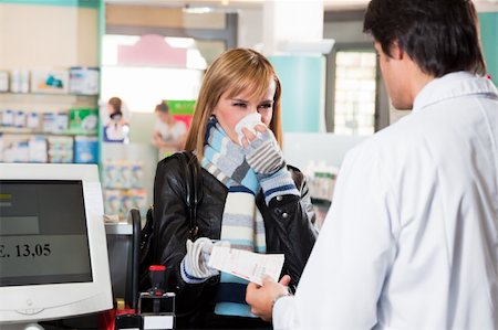 pharmacy purchase - sick woman giving prescription to pharmacist Stock Photo - Budget Royalty-Free & Subscription, Code: 400-04110185